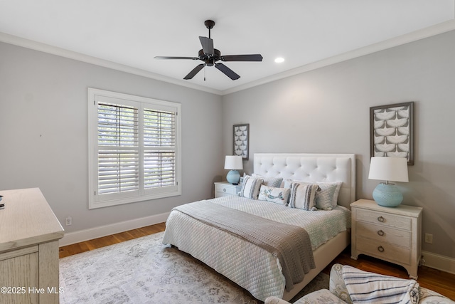 bedroom with wood finished floors, baseboards, ornamental molding, a ceiling fan, and recessed lighting