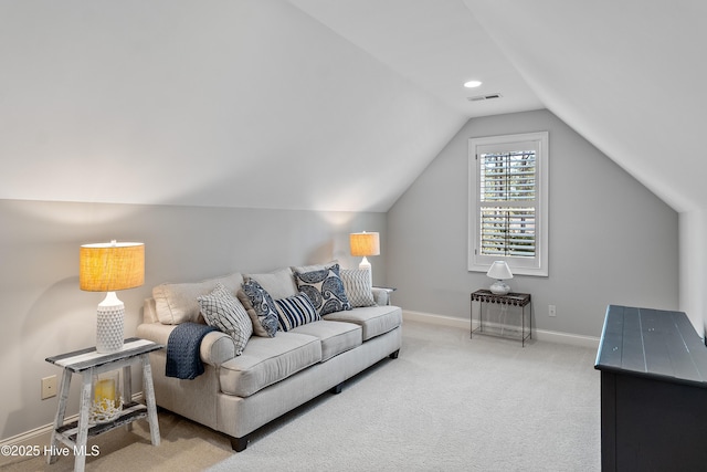 living area with carpet flooring, lofted ceiling, and baseboards