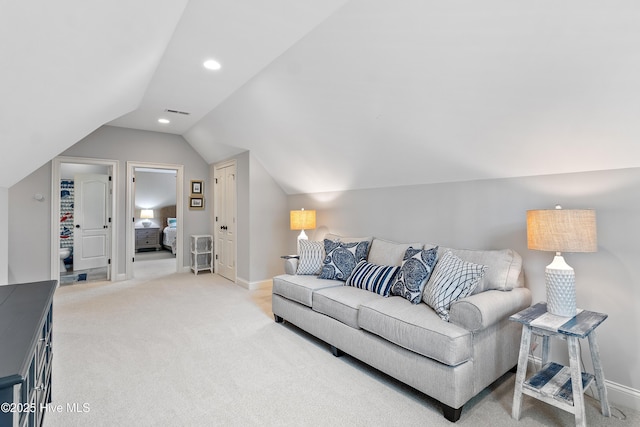 carpeted living area with lofted ceiling, baseboards, and recessed lighting