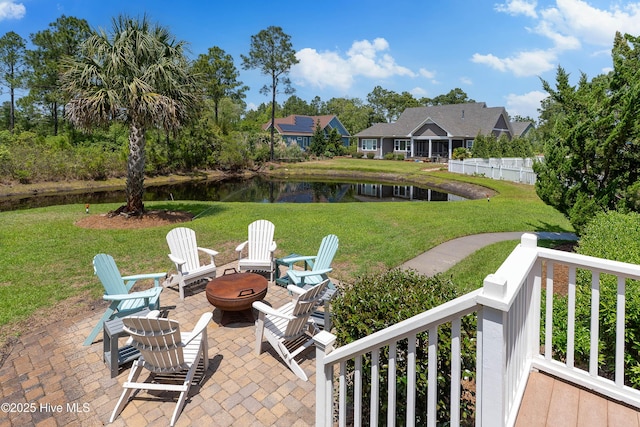 view of patio featuring a fire pit and a water view