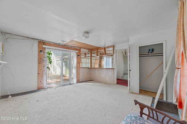 unfurnished bedroom featuring a closet and access to outside