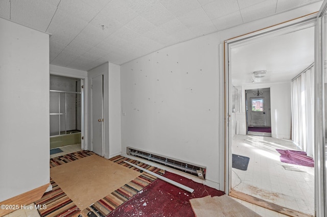interior space featuring a baseboard heating unit