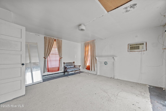 interior space with carpet floors and a wall unit AC
