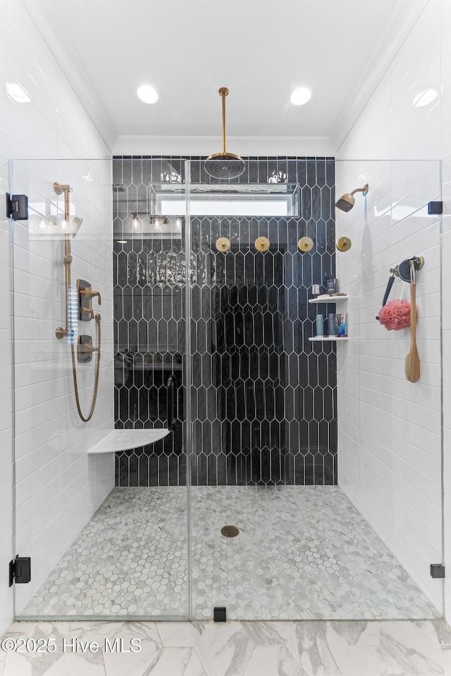full bathroom featuring ornamental molding and a stall shower