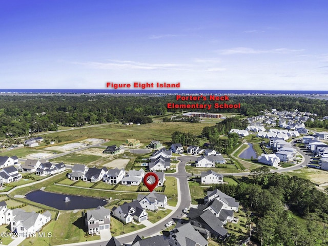 bird's eye view with a water view and a residential view