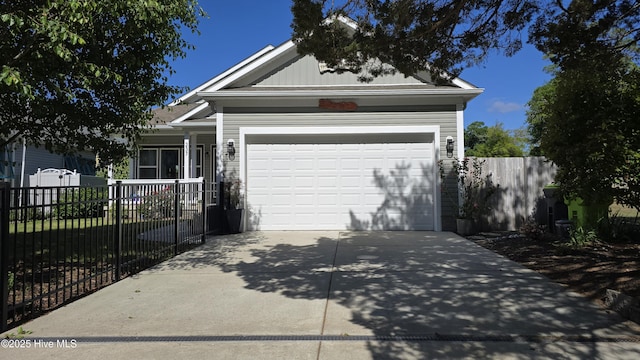 ranch-style home featuring a garage, fence, and driveway