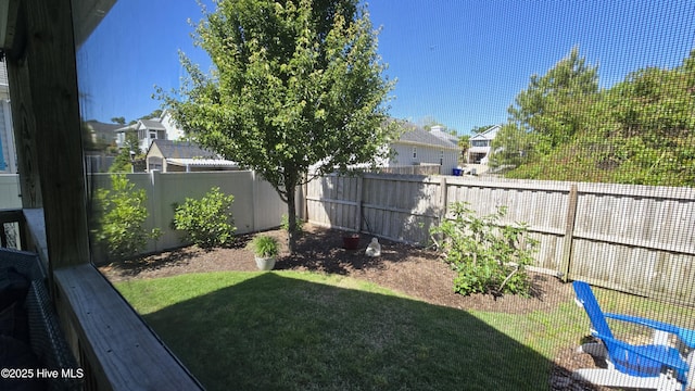 view of yard featuring a residential view and a fenced backyard
