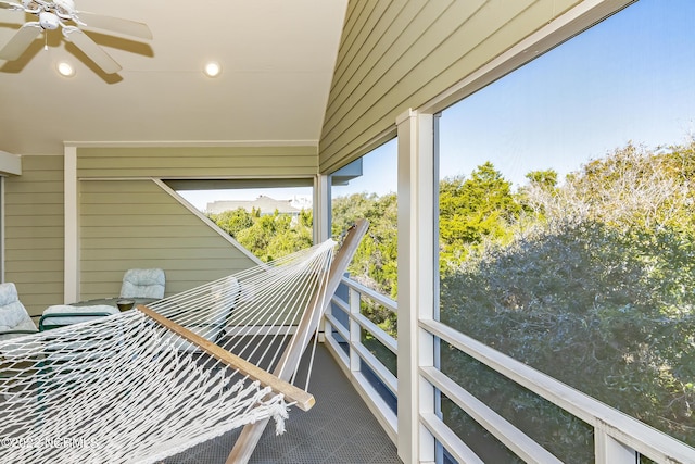 unfurnished sunroom featuring recessed lighting, a ceiling fan, and tile patterned flooring