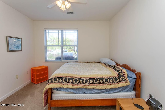 bedroom with carpet flooring, baseboards, and ceiling fan