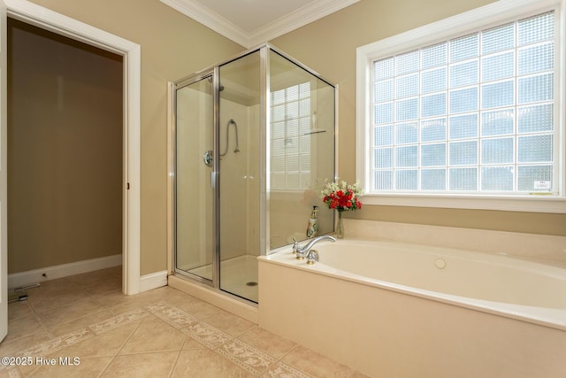 84 Deerwood Ln, Pinehurst, NC 28374 - bathroom with crown molding, baseboards, a bath, tile patterned floors, and a stall shower