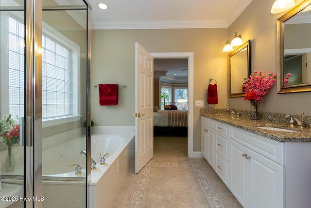 84 Deerwood Ln, Pinehurst, NC 28374 - ensuite bathroom featuring double vanity, a garden tub, a sink, tile patterned floors, and ornamental molding