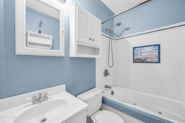 bathroom featuring toilet, a combined bath / shower with jetted tub, and vanity