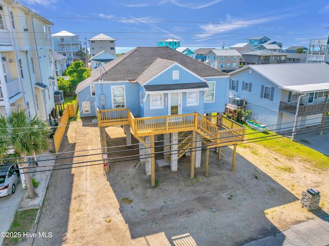 exterior space with a residential view and a wooden deck