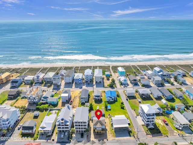 aerial view featuring a beach view, a residential view, and a water view