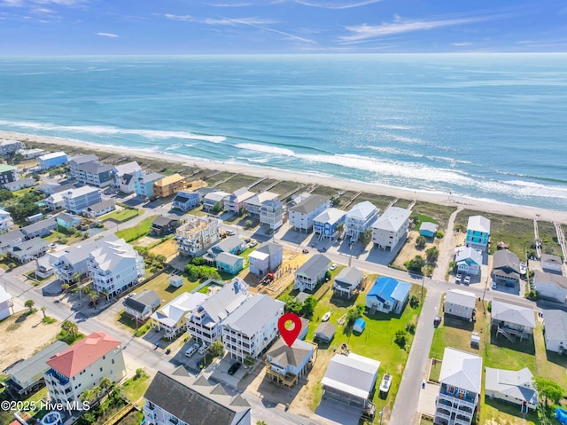 drone / aerial view with a beach view and a water view