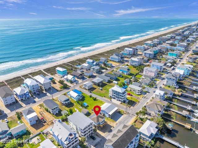 bird's eye view featuring a beach view and a water view