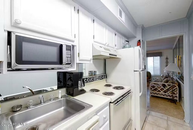 kitchen featuring white range with electric cooktop, a sink, light countertops, stainless steel microwave, and under cabinet range hood