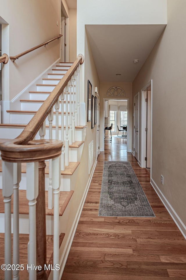 920 Diamondhead Dr S, Pinehurst, NC 28374 - interior space featuring stairs, baseboards, visible vents, and wood finished floors