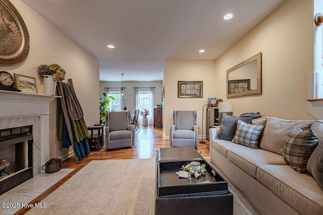 920 Diamondhead Dr S, Pinehurst, NC 28374 - living area featuring recessed lighting, baseboards, wood finished floors, and a fireplace