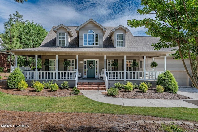 920 Diamondhead Dr S, Pinehurst, NC 28374 - country-style home featuring a garage, a shingled roof, and covered porch