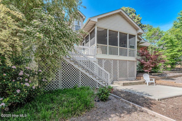 920 Diamondhead Dr S, Pinehurst, NC 28374 - rear view of property with a sunroom, a patio area, and stairway