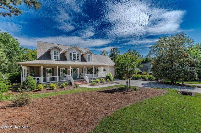 920 Diamondhead Dr S, Pinehurst, NC 28374 - view of front of home featuring a porch, a garage, aphalt driveway, and a front yard