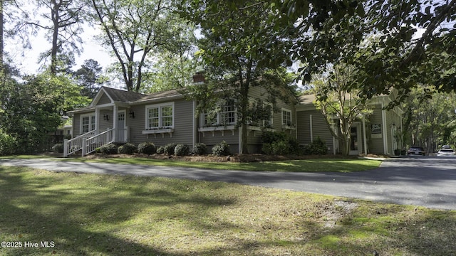 1914 Howard Ave, Tarboro, NC 27886 - ranch-style house featuring a chimney, aphalt driveway, and a front lawn