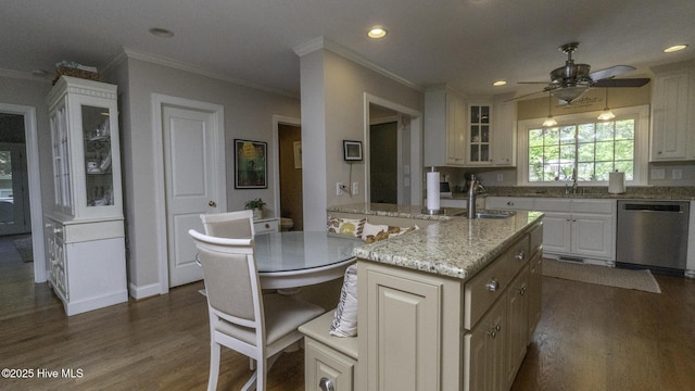 1914 Howard Ave, Tarboro, NC 27886 - kitchen with a sink, crown molding, dark wood-style flooring, dishwasher, and recessed lighting