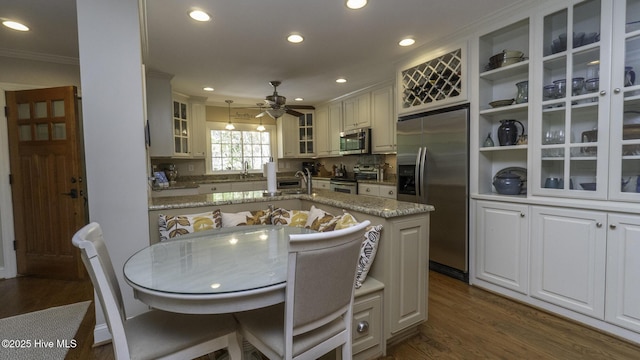 1914 Howard Ave, Tarboro, NC 27886 - kitchen featuring recessed lighting, dark wood finished floors, crown molding, a ceiling fan, and appliances with stainless steel finishes