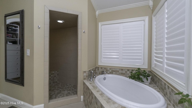 1914 Howard Ave, Tarboro, NC 27886 - bathroom featuring a bath, tile patterned flooring, a stall shower, and ornamental molding
