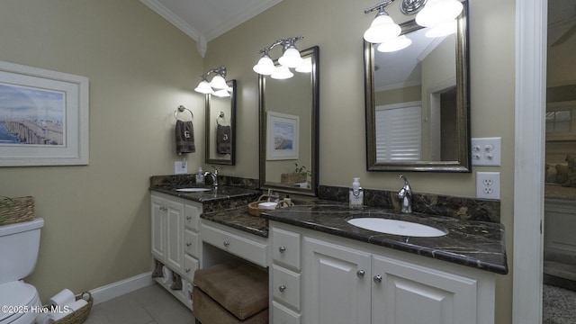 1914 Howard Ave, Tarboro, NC 27886 - full bathroom with a sink, double vanity, ornamental molding, and toilet