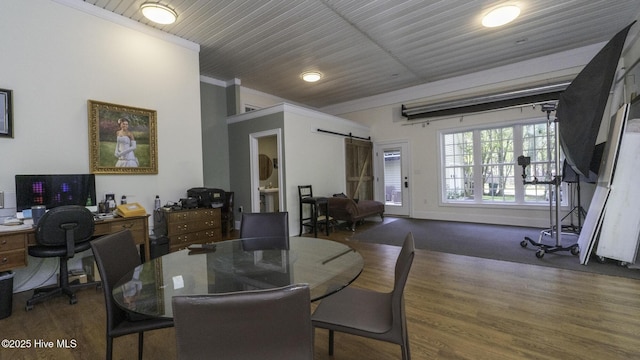 1914 Howard Ave, Tarboro, NC 27886 - dining space with crown molding, a barn door, and wood finished floors