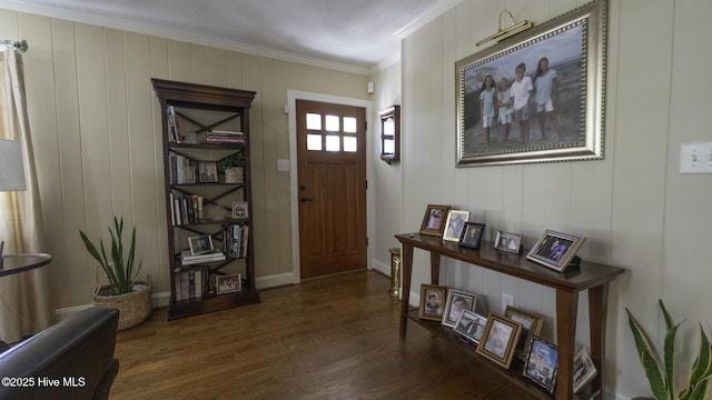 1914 Howard Ave, Tarboro, NC 27886 - foyer entrance with baseboards, crown molding, and dark wood-style floors