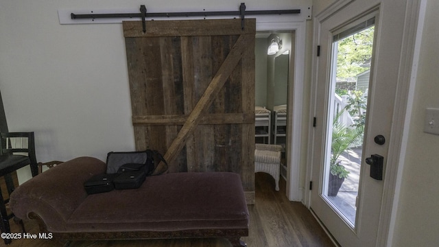 1914 Howard Ave, Tarboro, NC 27886 - interior space with a barn door, access to exterior, and wood finished floors