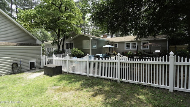 1914 Howard Ave, Tarboro, NC 27886 - rear view of house with a chimney, fence, and a lawn