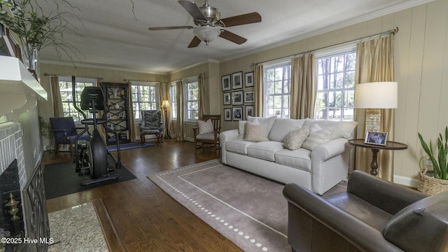 1914 Howard Ave, Tarboro, NC 27886 - living area featuring a fireplace, ornamental molding, a ceiling fan, and wood finished floors