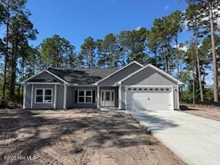 view of front facade featuring an attached garage and driveway