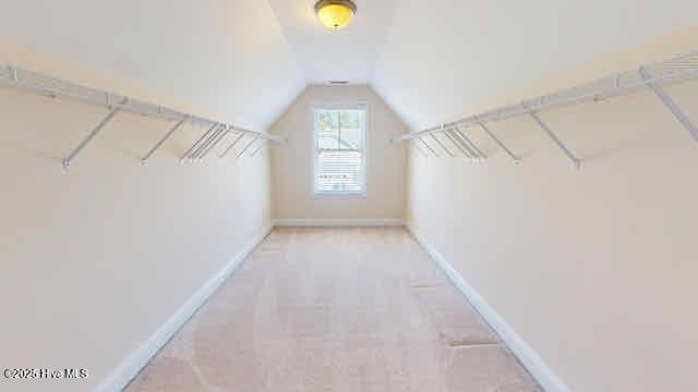 spacious closet featuring lofted ceiling