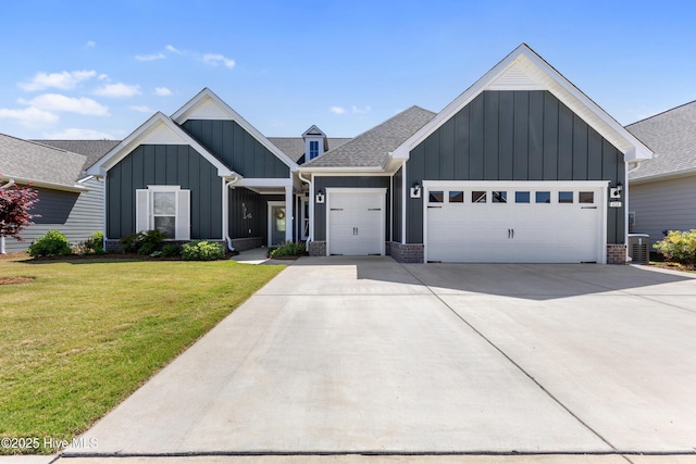 modern farmhouse featuring a garage, board and batten siding, concrete driveway, and a front lawn