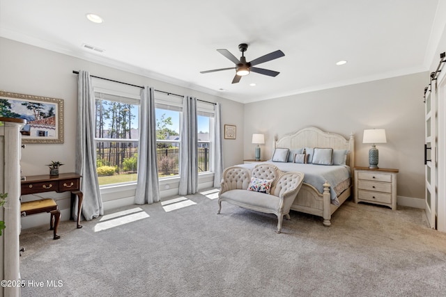 carpeted bedroom with crown molding, visible vents, ceiling fan, recessed lighting, and a barn door