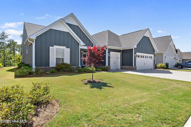 view of front facade featuring board and batten siding, an attached garage, driveway, and a front yard