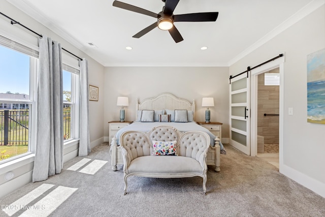 bedroom with crown molding, visible vents, baseboards, a barn door, and carpet