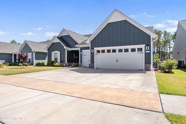 modern inspired farmhouse with board and batten siding, an attached garage, concrete driveway, and a front lawn