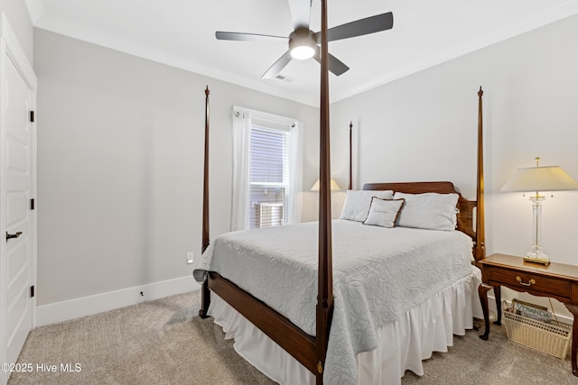 carpeted bedroom with a ceiling fan, baseboards, and visible vents