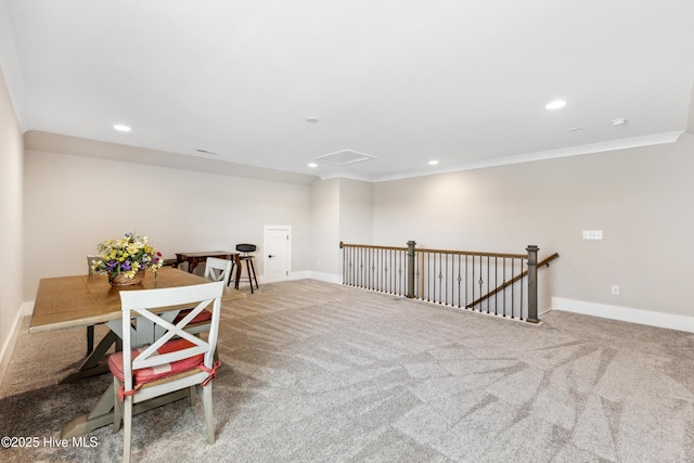sitting room with crown molding, carpet flooring, recessed lighting, baseboards, and an upstairs landing