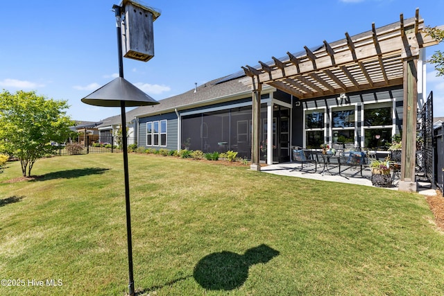back of property with fence, a pergola, a yard, and a patio area