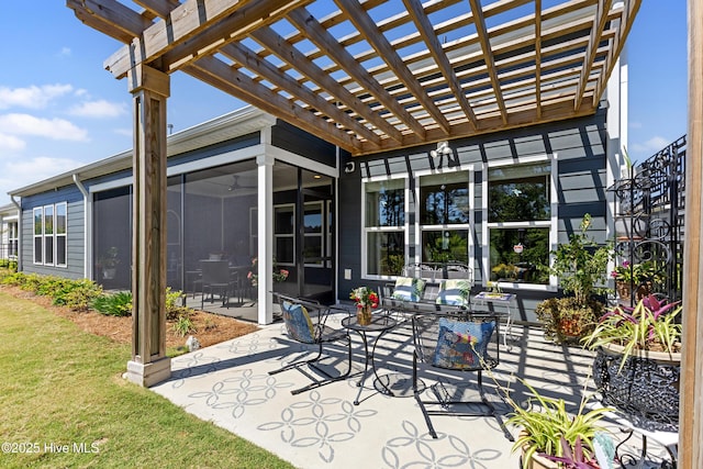 view of patio featuring a pergola and a sunroom