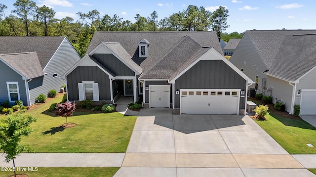 view of front of home featuring board and batten siding, a front lawn, roof with shingles, and a garage