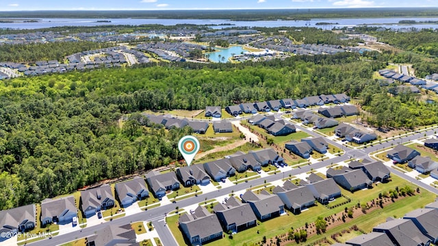 bird's eye view with a water view and a residential view