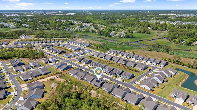 bird's eye view featuring a water view and a residential view